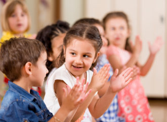 Preschool children playing in classroom.