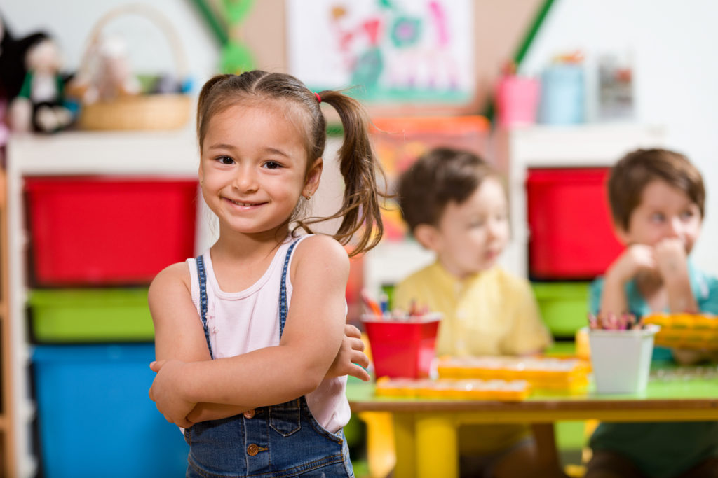 Little girl posing in classroom