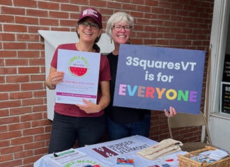 Mariana Sears from Hunger Free Vermont at the Orleans meals site with volunteer Joanna Burgess